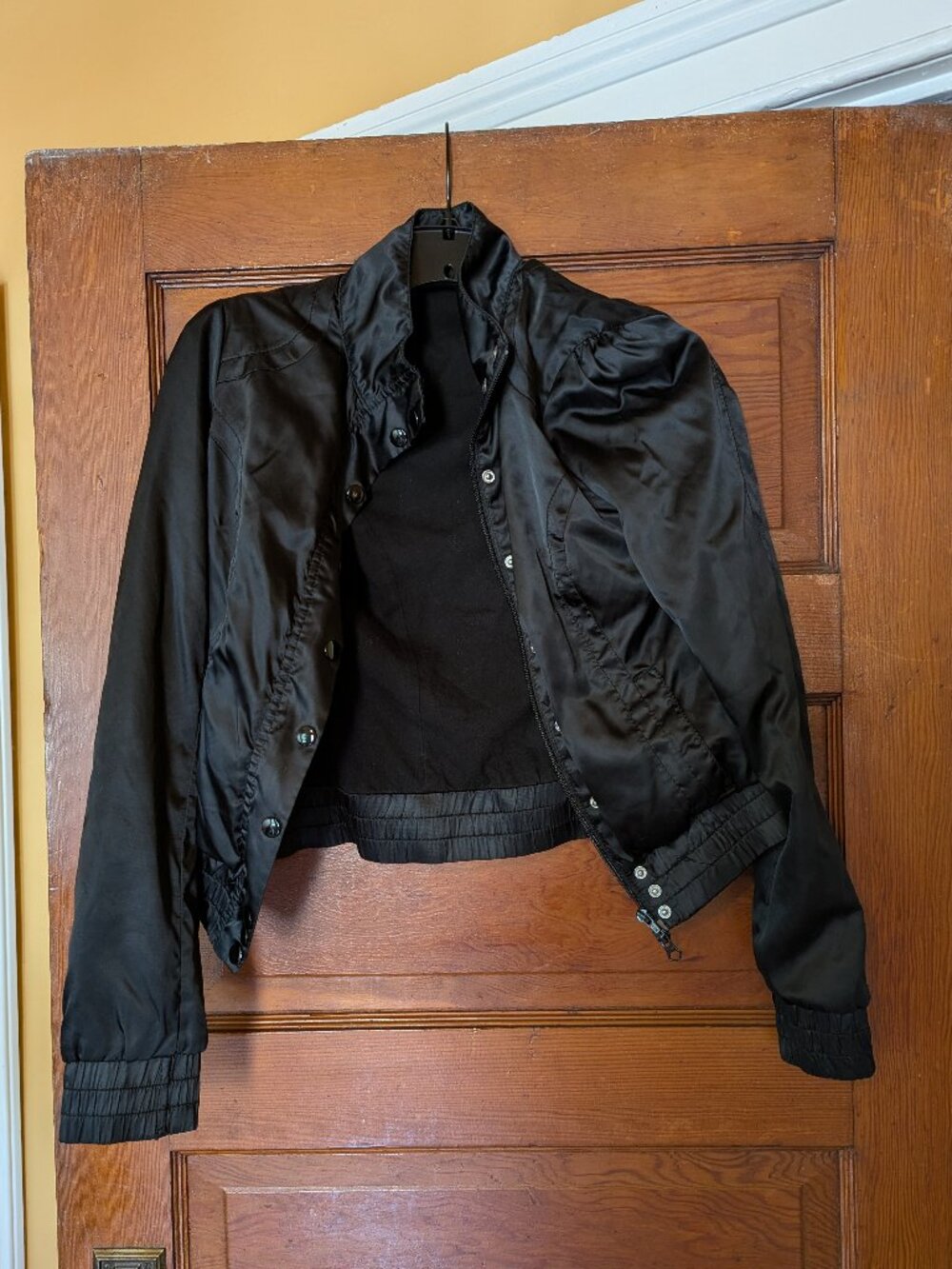 Black bomber jacket with satin-like fabric